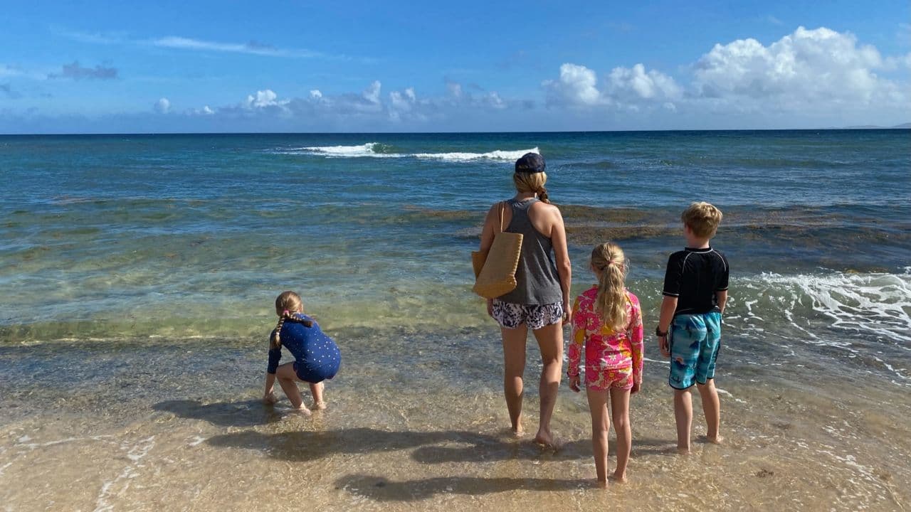 Mom and Kids Standing on the Beach