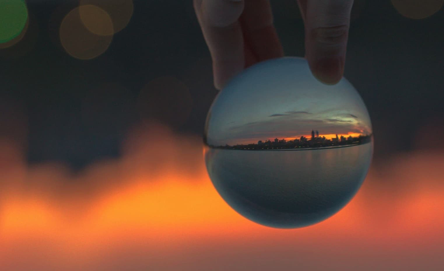 crystal ball with sunset skyline