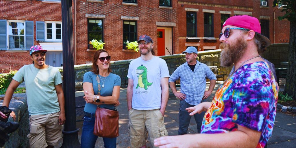 Tye Dyed Tour Guide Talking To Guests