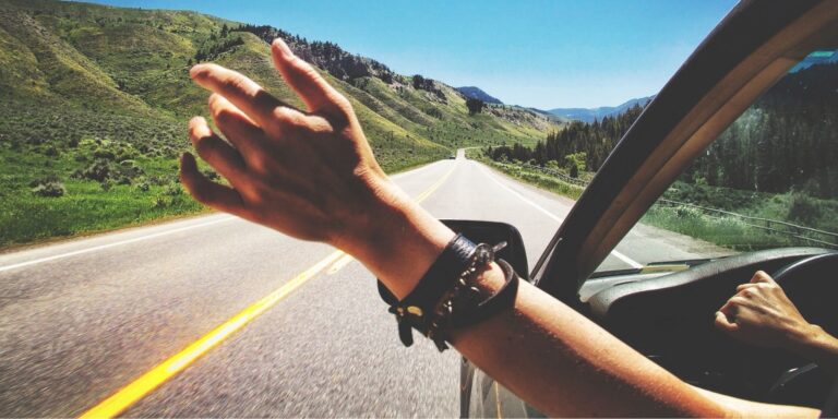 Driving on the highway with one hand out the window