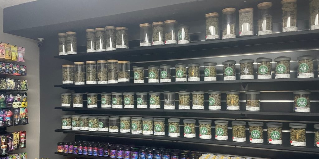 A wall full of jars of cannabis in a dispensary in Michigan