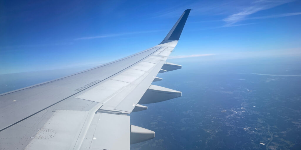 Looking out over the wing of an airplane mid-flight